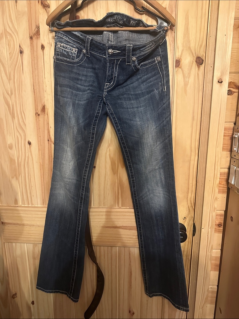 Vintage Y2K Miss Me Jeans with rhinestone-embellished Fleur-de-Lis back pockets